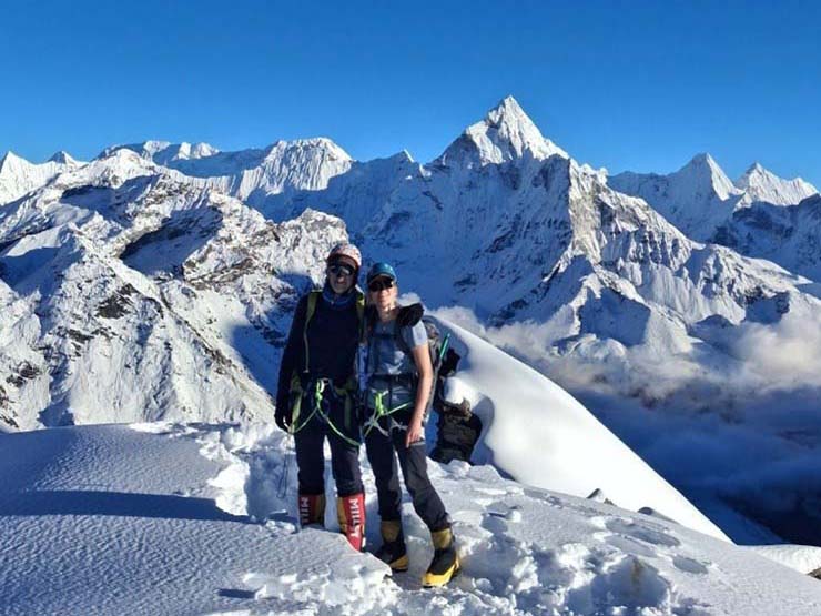 Dag Lund and Iselin R. Lund summiting Lobuche East after days of challenging conditions.
